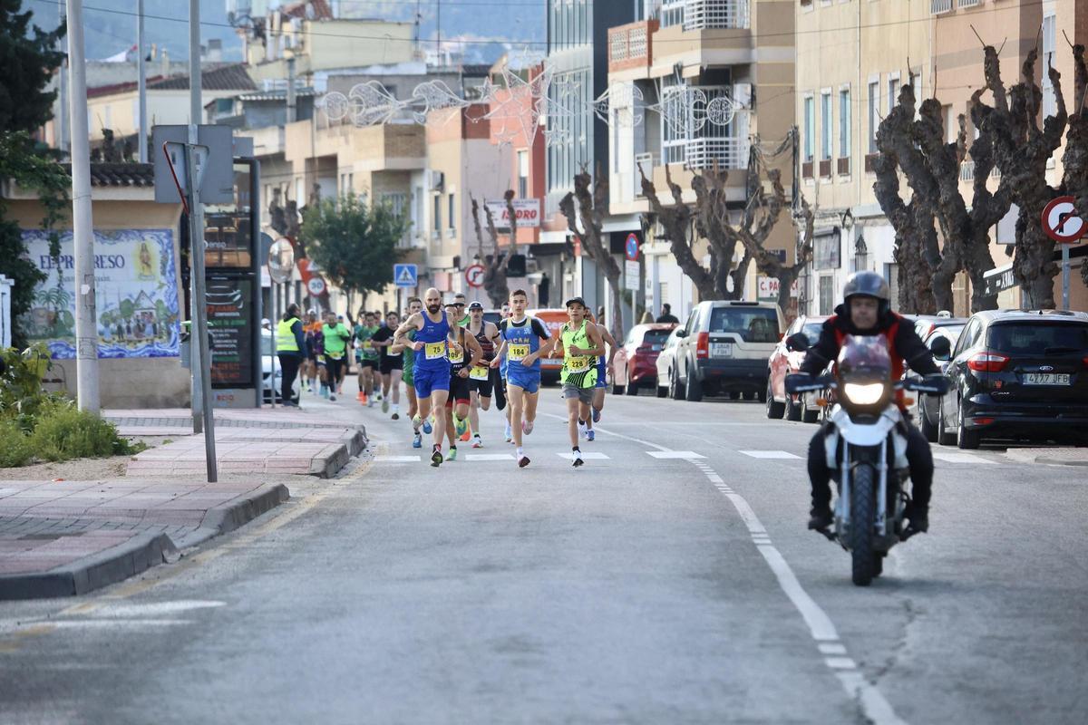 Las imágenes de la carrera popular solidaria en el barrio de El Progreso