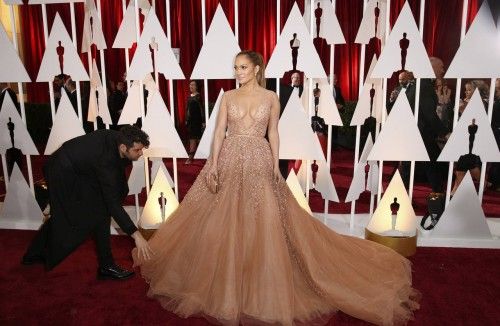 Singer Jennifer Lopez wears a gown by Elie Saab as she arrives at the 87th Academy Awards in Hollywood