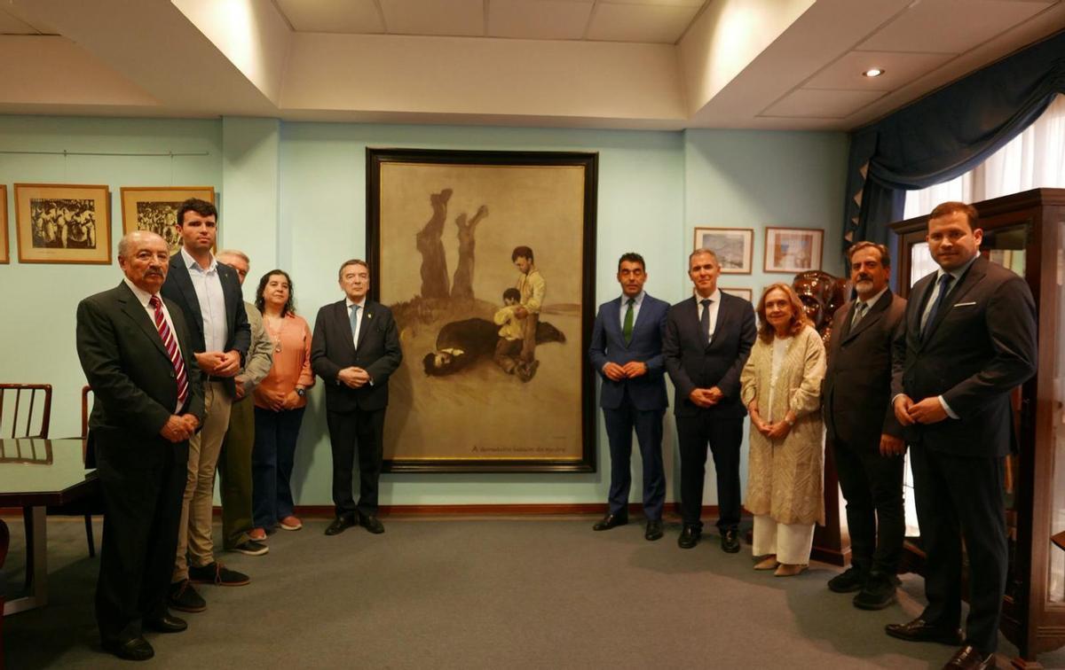 Luis López, con cargos de la Diputación y argentinos, ante «A derradeira leición do mestre».