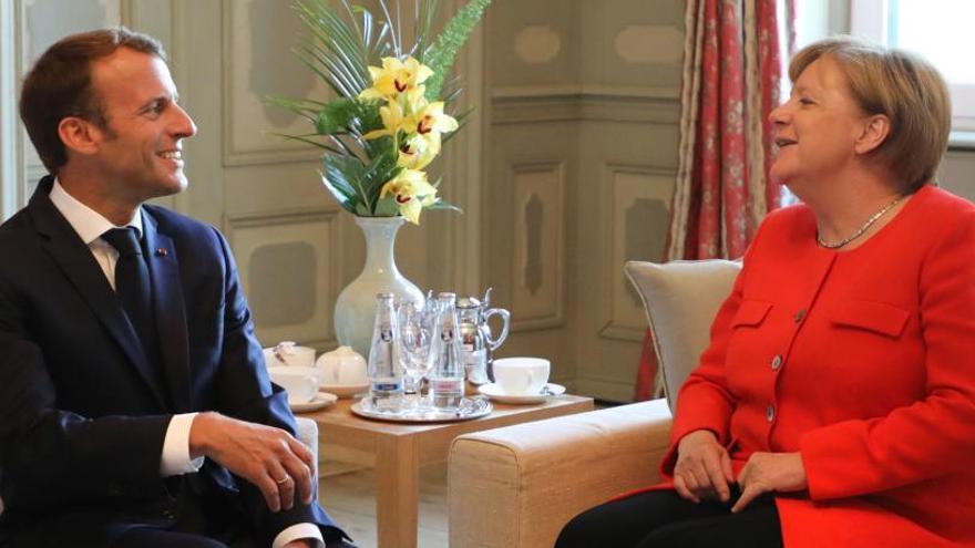 Macron y Merkel, durante el encuentro que han mantenido en Berlín