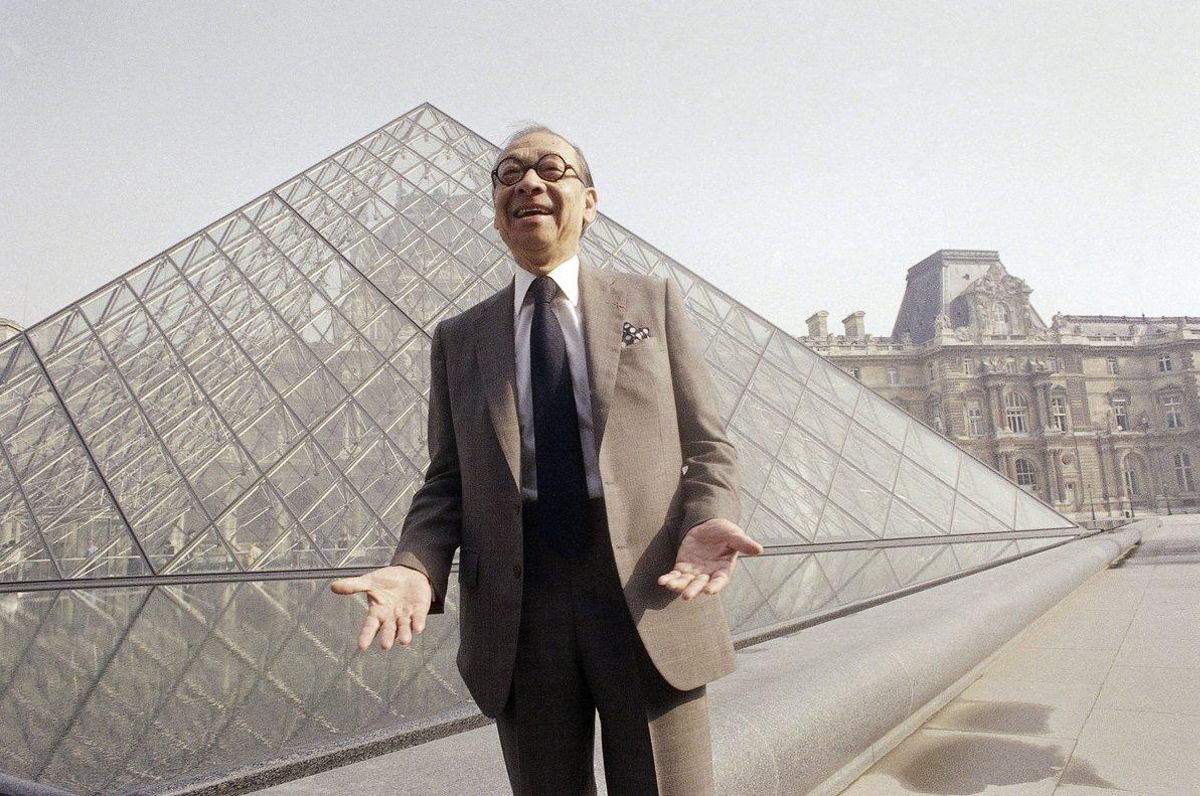 FILE - In this March 29 1989 file photo Chinese-American architect I M Pei laughs while posing for a portrait in front of the Louvre glass pyramid which he designed in the museum s Napoleon Courtyard prior to its inauguration in Paris Pei the globe-trotting architect who revived the Louvre museum in Paris with a giant glass pyramid and captured the spirit of rebellion at the multi-shaped Rock and Roll Hall of Fame has died at age 102 a spokesman confirmed Thursday May 16 2019 AP Photo Pierre Gleizes File FILE - In this March 29 1989 file photo Chinese-American architect I M Pei laughs while posing for a portrait in front of the Louvre glass pyramid which he designed in the museum s Napoleon Courtyard prior to its inauguration in Paris Pei the globe-trotting architect who revived the Louvre museum in Paris with a giant glass pyramid and captured the spirit of rebellion at the multi-shaped Rock and Roll Hall of Fame has died at age 102 a spokesman confirmed Thursday May 16 2019 AP Photo Pierre Gleizes File