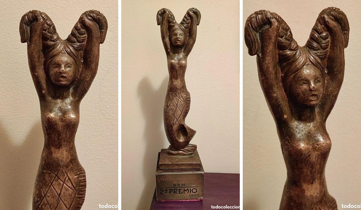 Imagen de la Sirenita de bronce que se otorgó a las segundas clasificadas y que ahora se subasta.