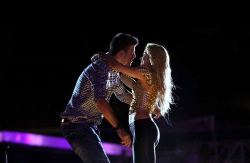 Singer Shakira embraces her boyfriend, Barcelona's player Gerard Pique during her concert in Barcelona