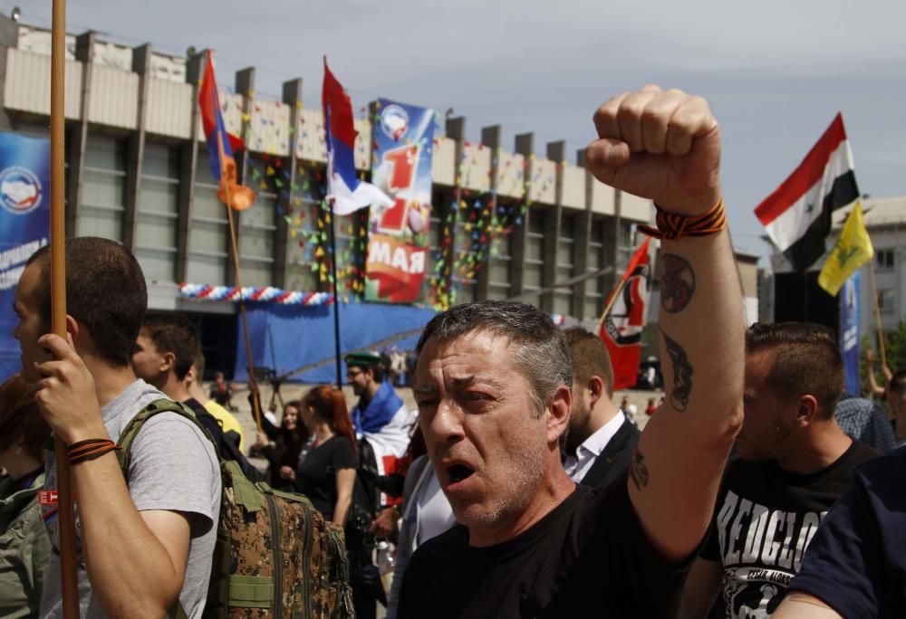 People shout slogans during May Day rally in ...