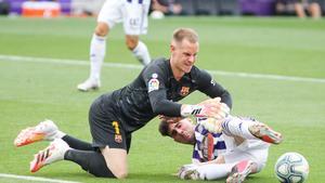 Kike Perez of Real Valladolid and Marc-Andre Ter Stegen of FC Barcelona fight for the ball during the spanish league, La Liga, football match played between Real Valladolid and FC Barcelona at Jose Zorrilla Stadium on July 11, 2020 in Valladolid, Spain.