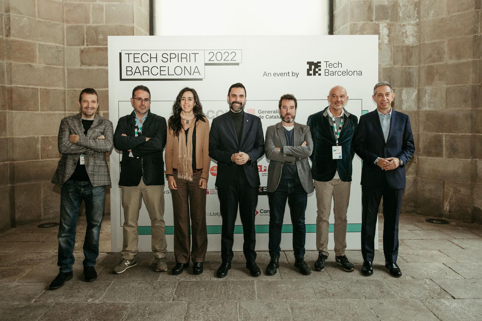 Miquel Martí, el CEO de Tech Barcelona; Ignasi Costas, el secretario general de Tech Barcelona; Mònica Roca, la presidenta de la Cambra de Comerç de Barcelona; Roger Torrent, el MH Conseller d'Empresa i Treball de la Generalitat de Catalunya; Michael Donaldson, el comisionado de Innovació Digital, Administració Electrònica i Bon Govern del Ajuntament de Barcelona; Miguel Planas, el vicepresidente de Tech Barcelona; y Francesc Fajula, el CEO de Mobile World Capital.