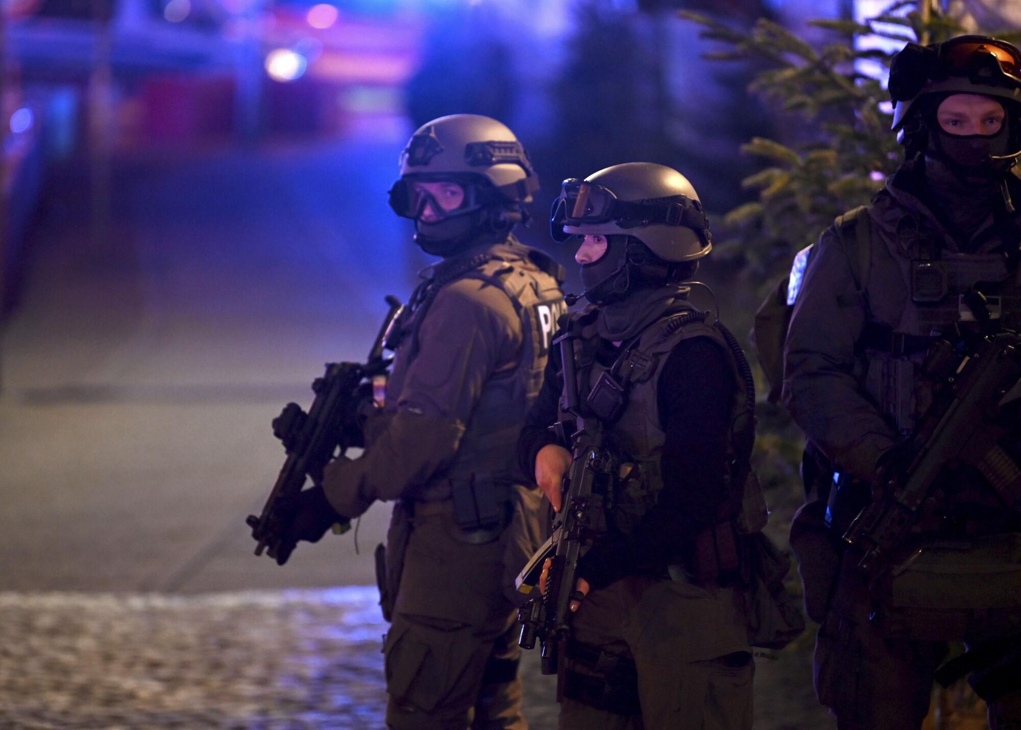 Special police forces attend an incident at the Christmas market in Magdeburg, Germany, Friday Dec. 20, 2024. (Heiko Rebsch/dpa via AP). GERMANY OUT; MANDATORY CREDIT