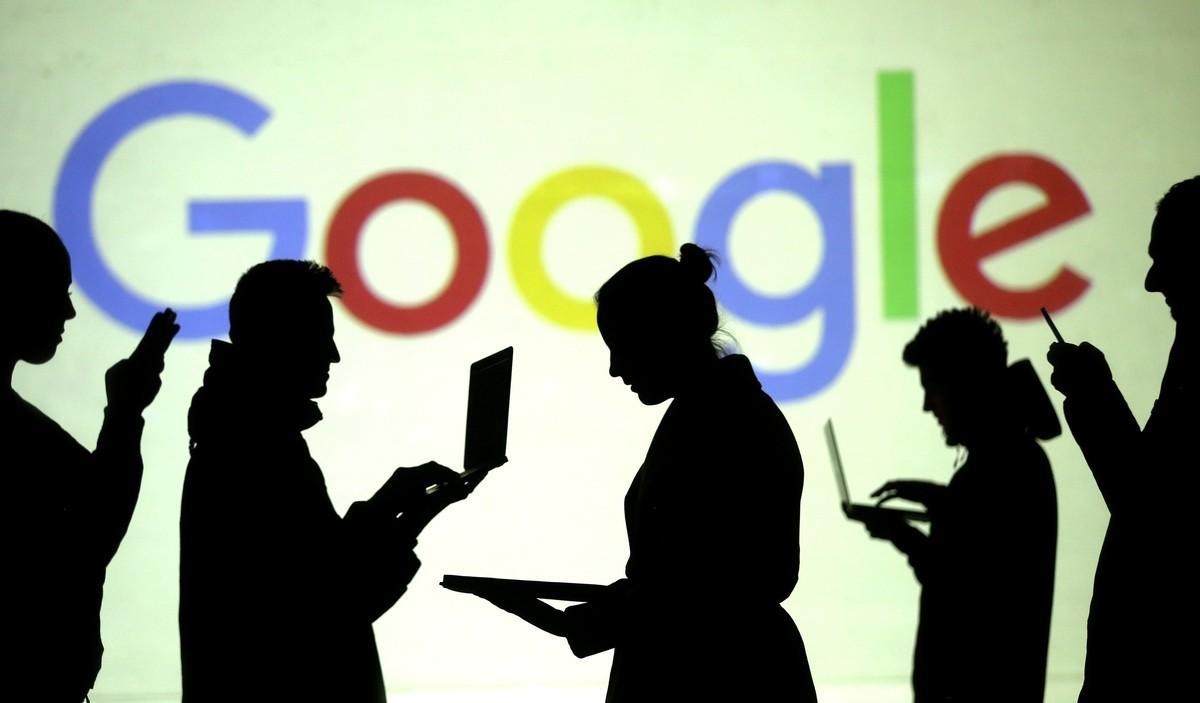 FILE PHOTO Silhouettes of laptop and mobile device users are seen next to a screen projection of Google logo in this picture illustration taken March 28 2018 REUTERS Dado Ruvic Illustration File Photo FILE PHOTO Silhouettes of laptop and mobile device users are seen next to a screen projection of Google logo in this picture illustration taken March 28 2018 REUTERS Dado Ruvic Illustration File Photo