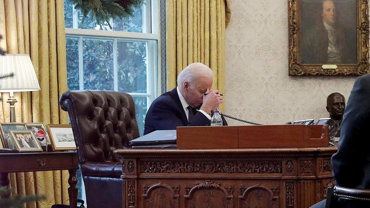 FILE PHOTO: U.S. President Joe Biden speaks by phone with Ukraine's President Volodymyr Zelenskiy in the Oval Office at the White House in Washington