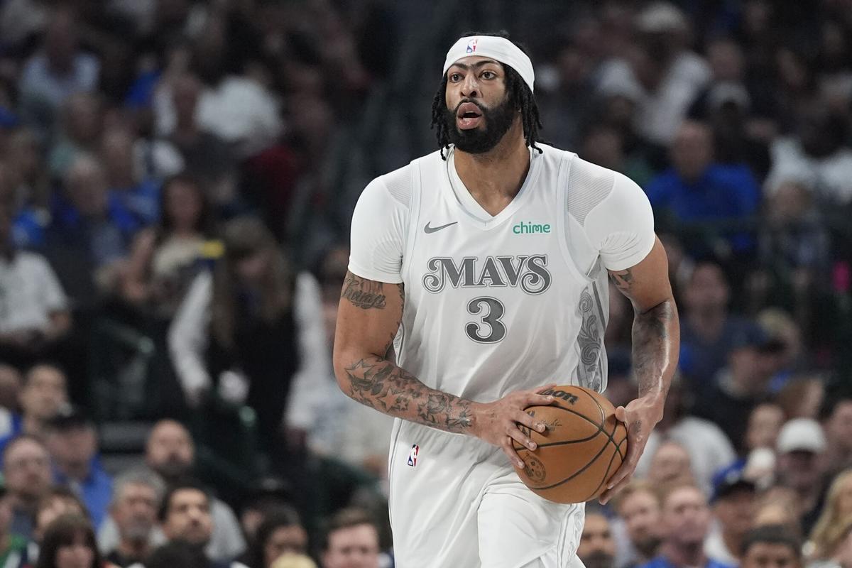 Dallas Mavericks forward Anthony Davis handles the ball during the first half of an NBA basketball game against the Houston Rockets Saturday, Feb. 8, 2025, in Dallas. (AP Photo/LM Otero)