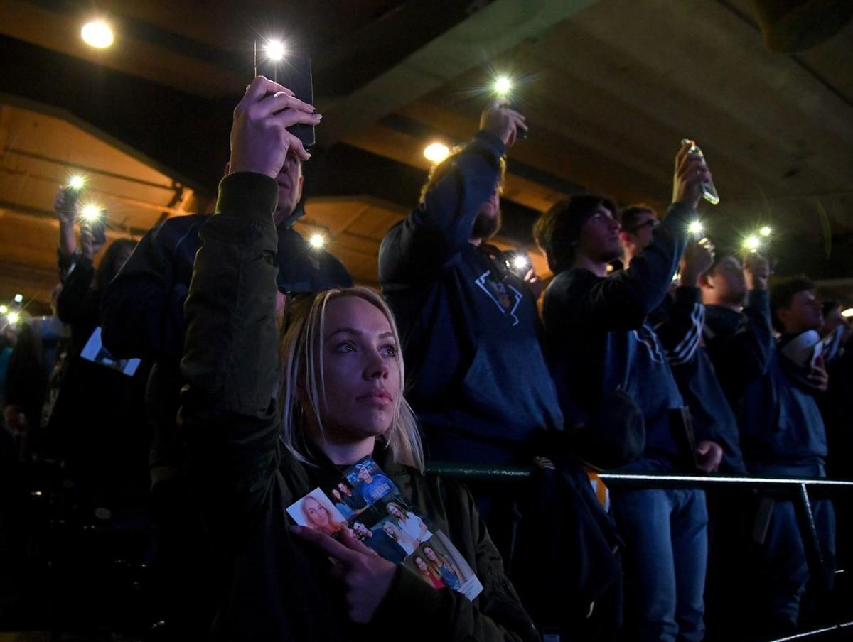 ANAHEIM, CA - FEBRUARY 10: Members of the community hold lights at the end of the memorial service honoring baseball coach John Altobelli, his wife, Keri, and their daughter Alyssa at Angel Stadium of Anaheim on February 10, 2020 in Anaheim, California. The Altobellis were traveling with former Lakers star Kobe Bryant, his 13-year-old daughter Gianna and four others when the helicopter crashed Jan. 26 in foggy conditions, killing everyone on board.   Jayne Kamin-Oncea/Getty Images/AFP