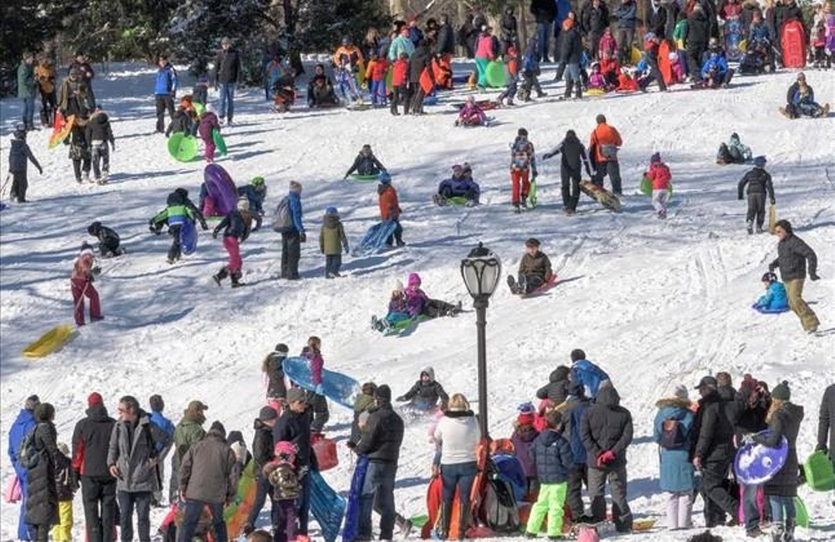 fcasals32531524 children slide in the snow in central park on janu160124194655