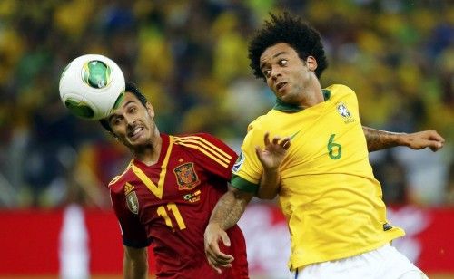Spain's Pedro fights for the ball with Brazil's Marcelo during their Confederations Cup final soccer match at the Estadio Maracana in Rio de Janeiro