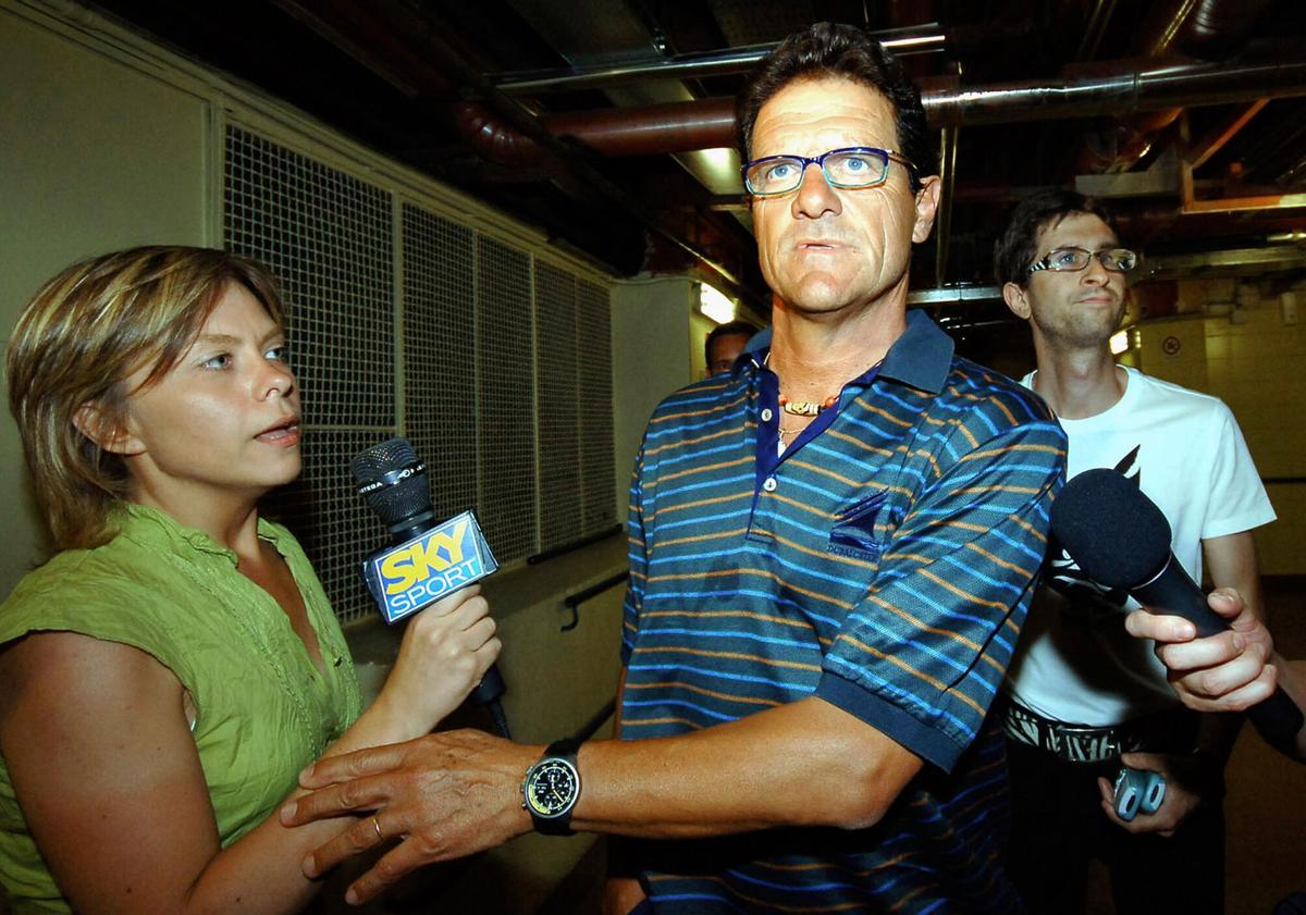 Resigning Juventus soccer team coach Fabio Capello, center, is followed by reporters after visiting former Juventus player Gianluca Pessotto, hospitalized at the Molinette hospital, in Turin, northern Italy, Tuesday, July 4, 2006. Earlier in the day Capello resigned as Juventus coach and is expected to be named new coach of Spanish club Real Madrid on Thursday. (AP Photo/Massimo Pinca)