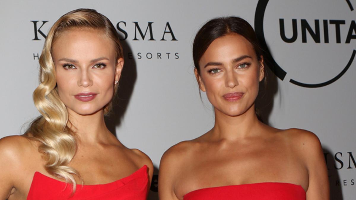 Las modelos Natasha Poly e Irina Shayk con el mismo vestido rojo en la gala de Unitas