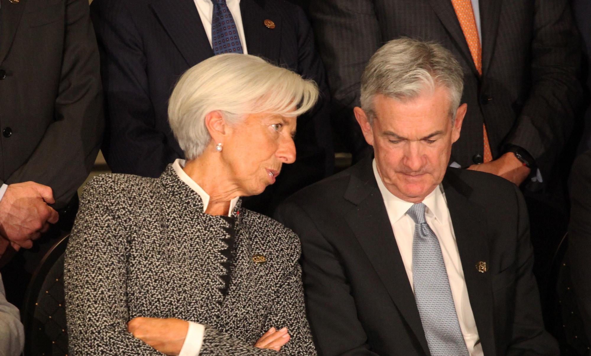 21 July 2018, Argentina, Buenos Aires: Christine Lagarde (M), Director of the International Monetary Fund, and Jerome Powell, President of the Federal Reserve, sit together for a group photo at the meeting of G20 finance ministers. Photo: . - Buenos Aires/Argentina  Claudio Santisteban/dpa