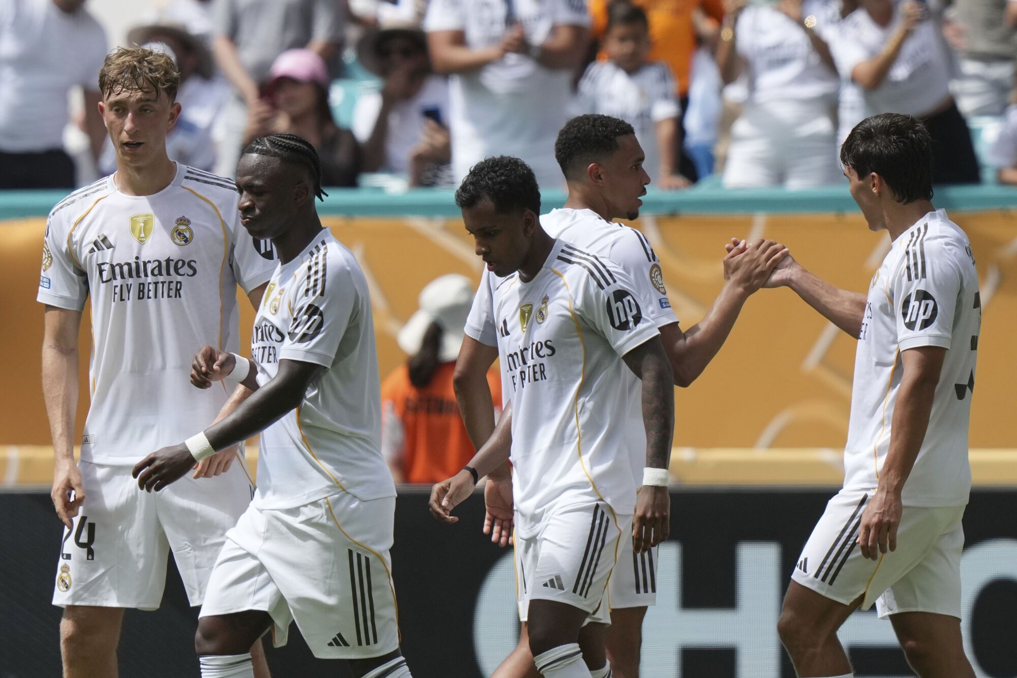 Real Madrid's Gonzalo Garcia, right, celebrates with teammates after scoring the opening goal of his team during the Club World Cup group H soccer match between Real Madrid and Al Hilal in Miami, Fla., Wednesday, June 18, 2025. (AP Photo/Lynne Sladky)
