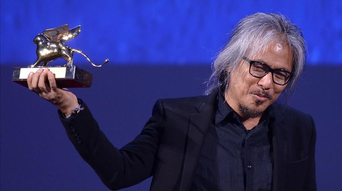 aabella35465420 director lav diaz holds the golden lion award for best film 160910203933