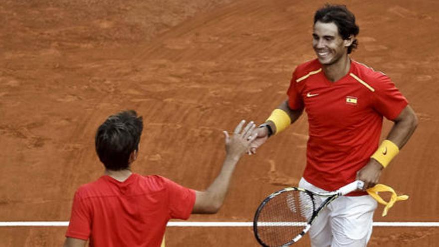 Marc López y Rafa Nadal en un partido de la Davis