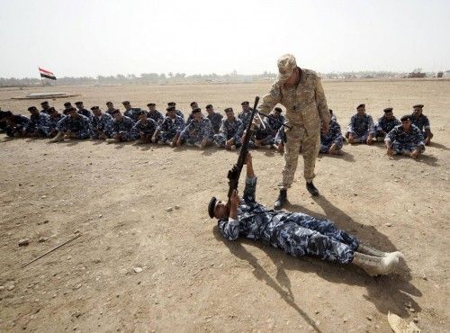 Volunteers who have joined the Iraqi security forces take part in a training session in Kerbala