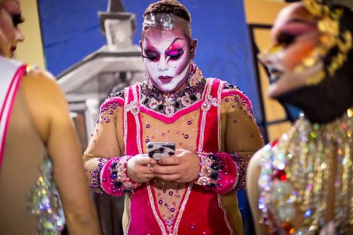 Participant prepares to perform in a drag queen ...