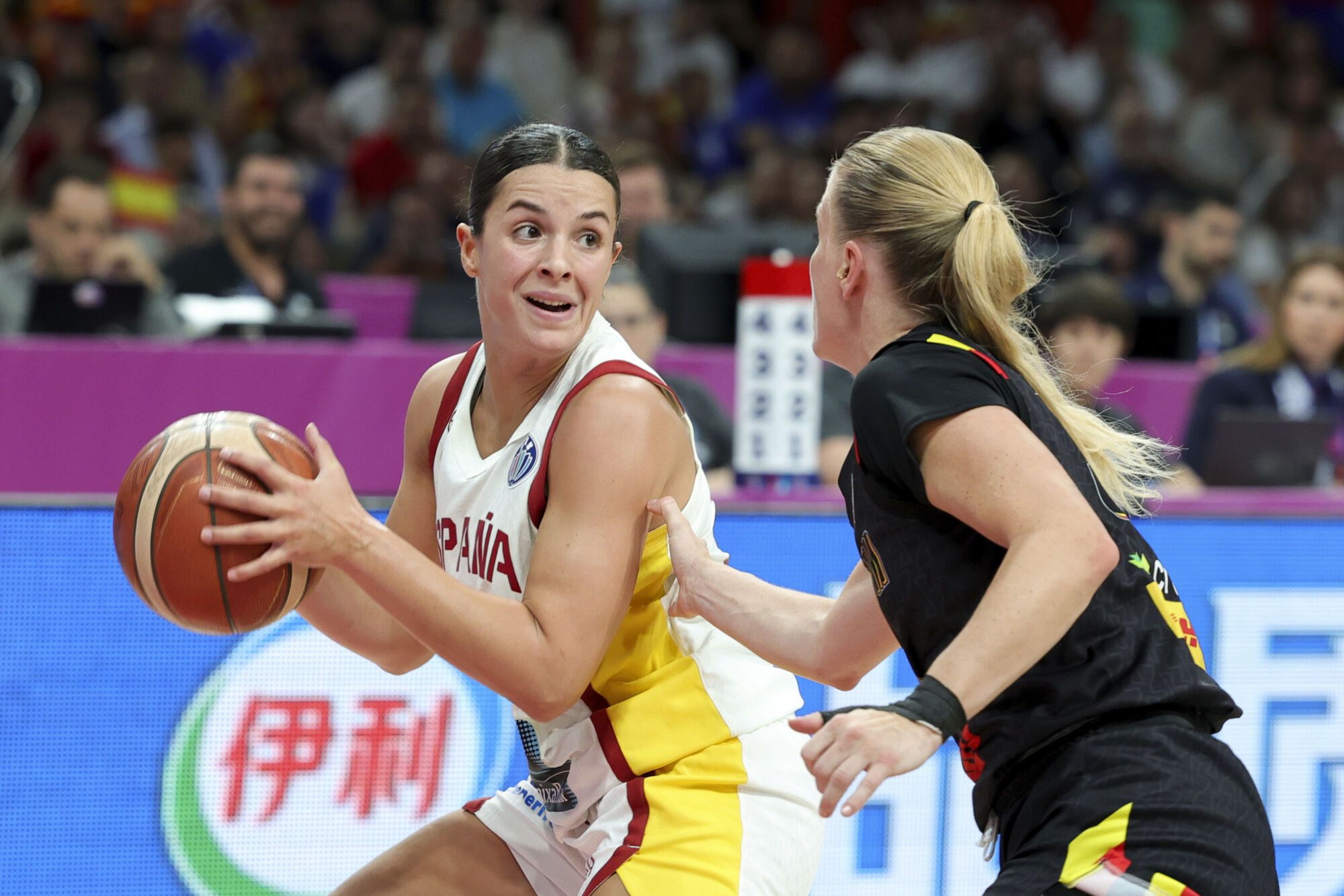 Spain's Elena Buenavida, left, fights for the ball against Belgium's Julie Allemand, during the FIBA Women's EuroBasket 2025 final match between Spain and Belgium at the Peace and Friendship Stadium in Piraeus near Athens, Greece, Sunday, June 29, 2025. (AP Photo/Yorgos Karahalis)