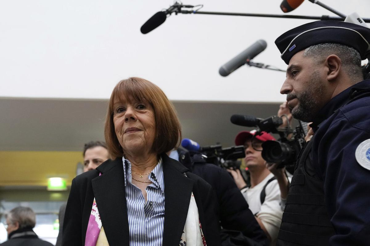 Gisele Pelicot, who was allegedly drugged by her now former husband so that he and others could assault her, arrives at the court house in Avignon, southern France, Thursday, Dec. 19, 2024. (AP Photo/Lewis Joly)