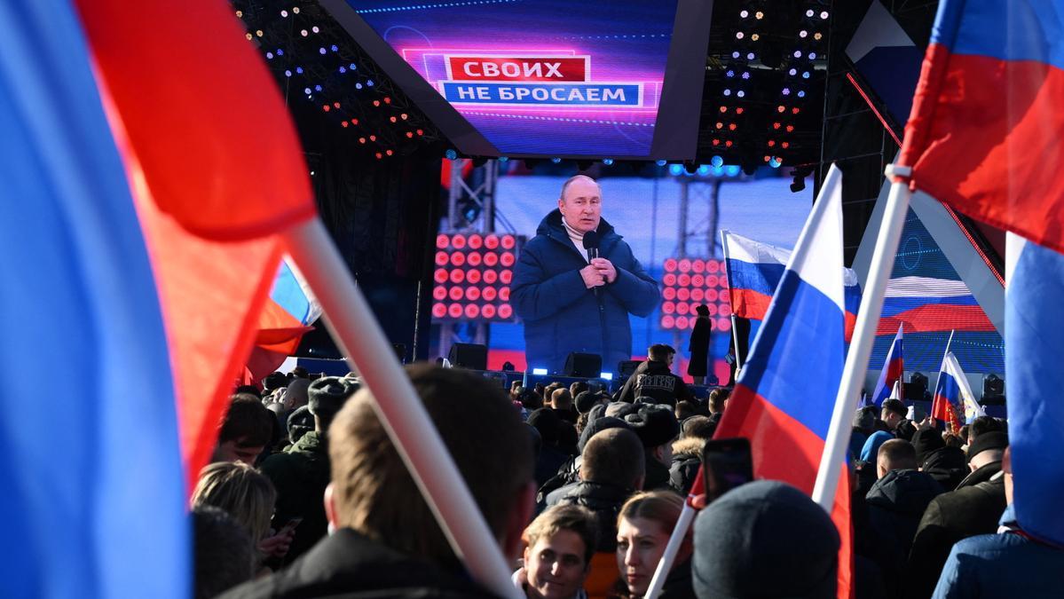 Russian President Vladimir Putin attends a concert marking the eighth anniversary of Russia's annexation of Crimea in Moscow