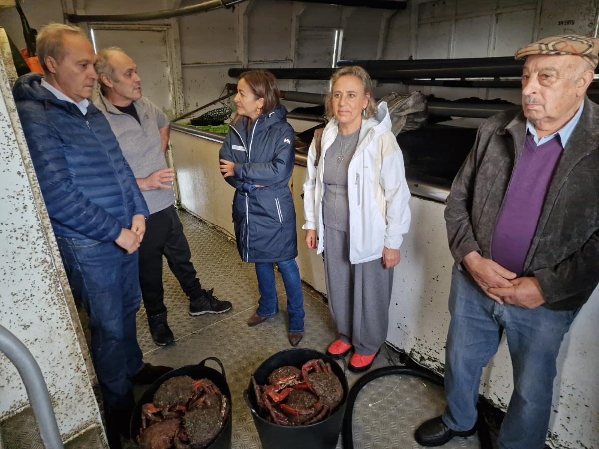 La visita de la conselleira a la lonja meca.