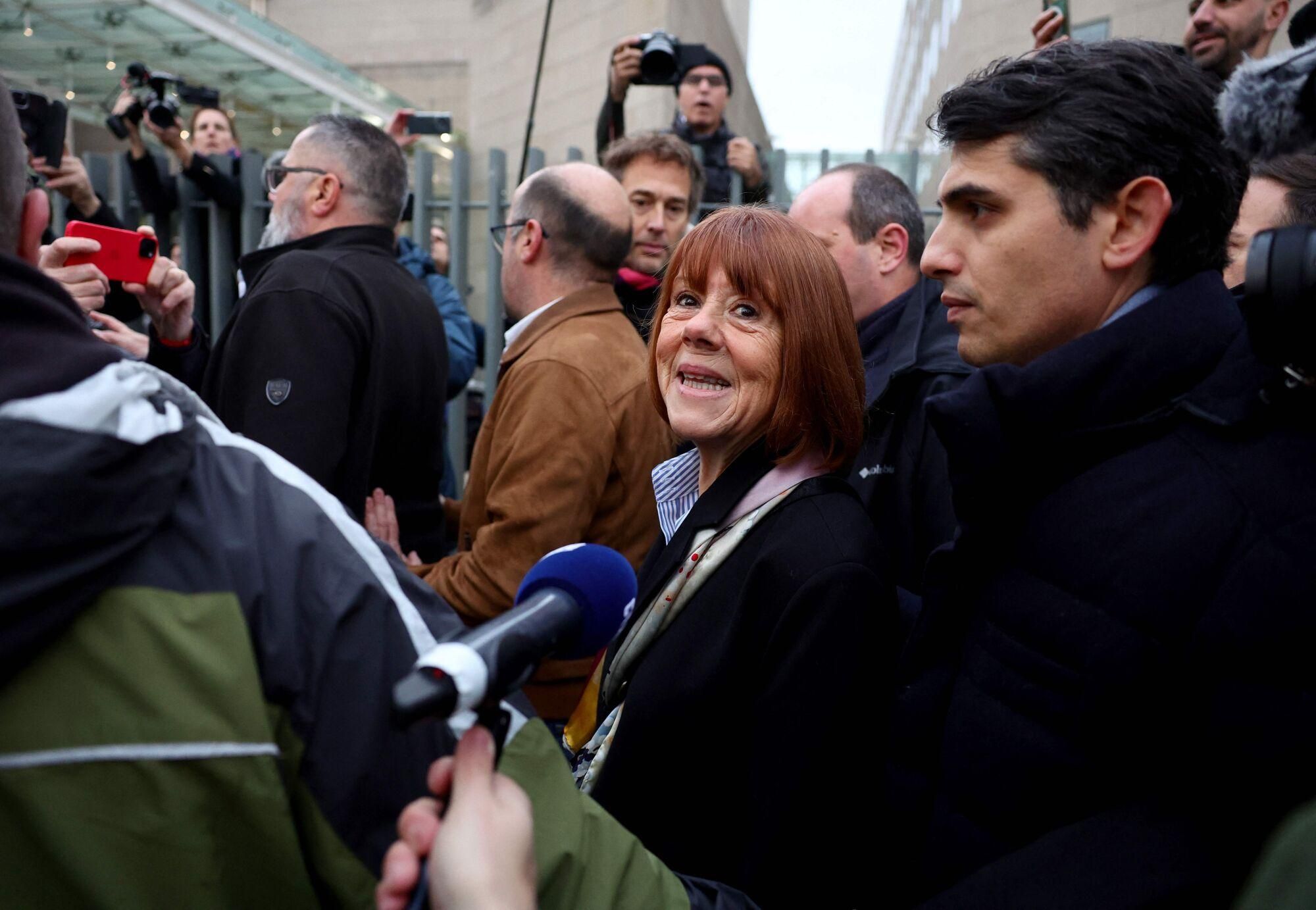 19 December 2024, France, Avignon: Gisele Pelicot (C) arrives with her lawyer Stephane Babonneau (R) at the courthouse in Avignon, where the verdict is expected in the trial against her ex-husband and 50 other defendants accused of drugging her and orchestrating several rapes over almost a decade. Photo: Clement Mahoudeau/AFP/dpa 19/12/2024 ONLY FOR USE IN SPAIN. Clement Mahoudeau/AFP/dpa;Crime, Law and Justice;--;crime;Sexual abuse trial in Avignon;