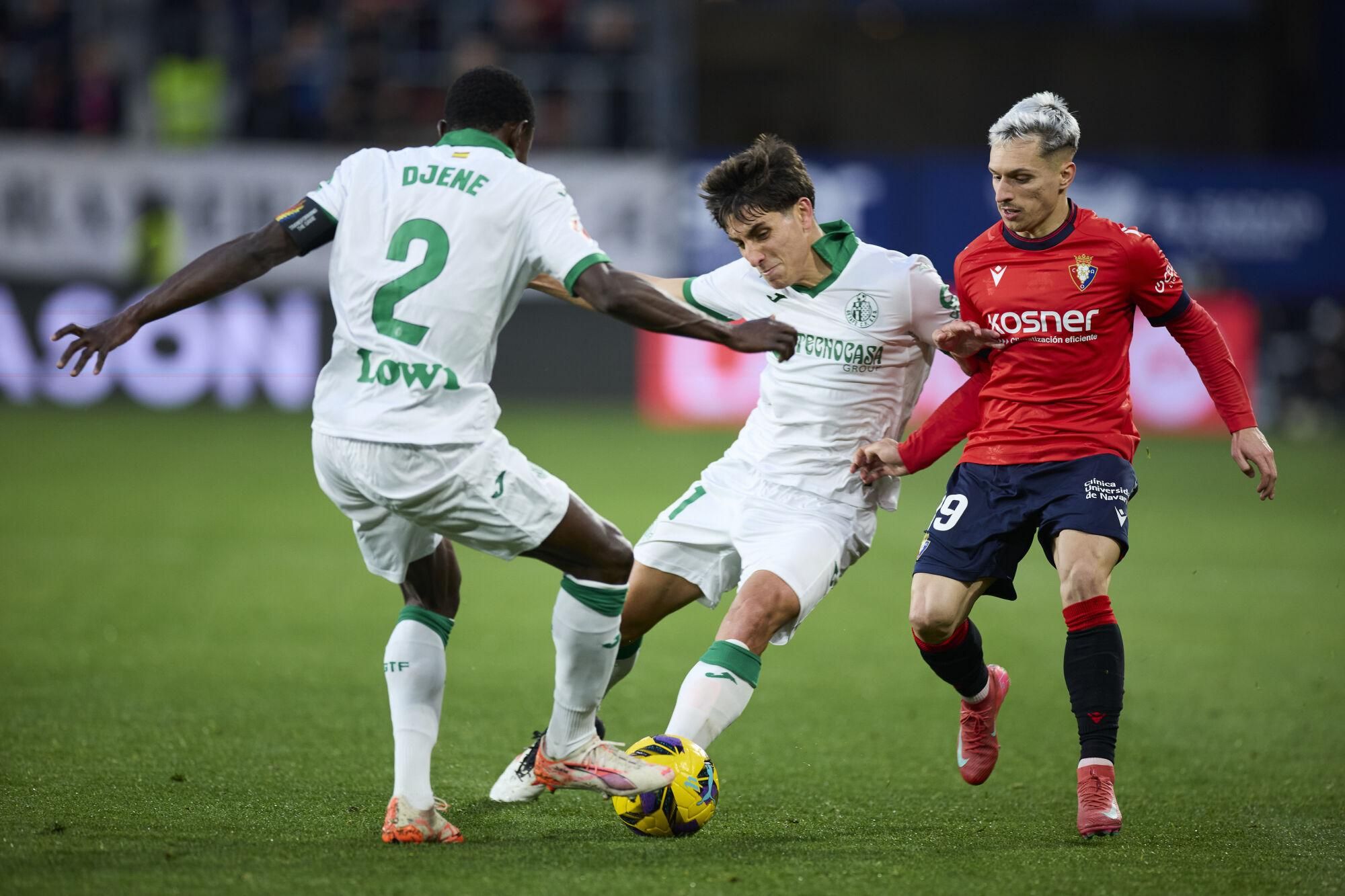 Djene Dakonam and Ramon Terrats of Getafe CF competes for the ball with Bryan Zaragoza of CA Osasuna during the LaLiga EA Sports match between CA Osasuna and Getafe CF at El Sadar on March 16, 2025, in Pamplona, Spain. AFP7 16/03/2025 ONLY FOR USE IN SPAIN. Ricardo Larreina / AFP7 / Europa Press;2025;SPAIN;Soccer;Sport;ZSOCCER;ZSPORT;CA Osasuna v Getafe CF - La Liga EA Sports;