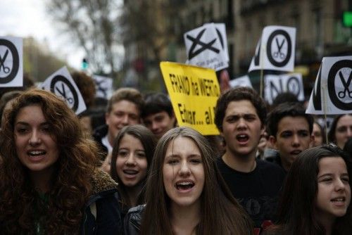 Students shout slogans during a demonstration on the second day of a 48-hour nationwide student strike to protest against rising fees and educational cuts in Madrid