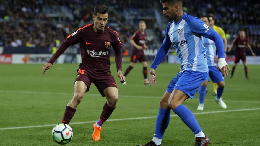 El Barça tumba a un Málaga sin garra y se mantiene firme en su lucha por la Liga