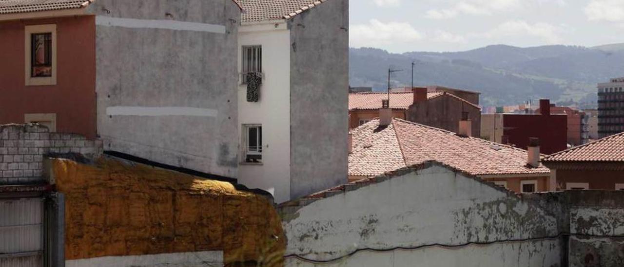 Medianeras en el barrio de Cimadevilla.