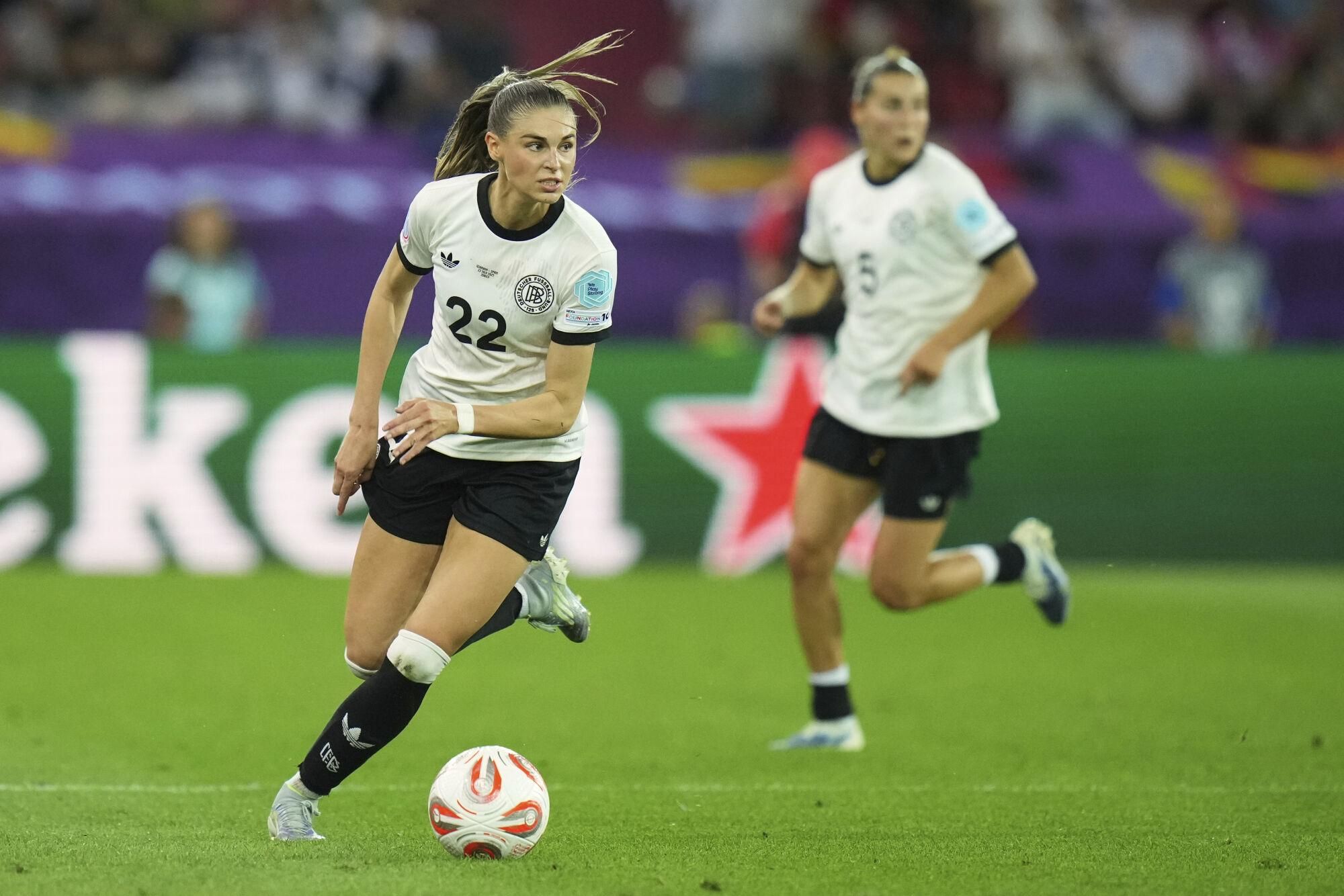 Germany's Jule Brand runs with the ball during the Women's Euro 2025 semifinals soccer match between Germany and Spain at Stadion Letzigrund in Zurich, Switzerland, Wednesday, July 23, 2025. (AP Photo/Alessandra Tarantino)