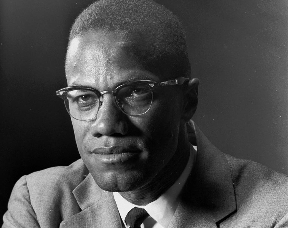 ** FILE ** Malcolm X, the Black Muslim leader, is photographed in New York  on March 5, 1964.  Malcom X was assassinated in 1965 and 32 years later his wife Betty Shabazz was killed in a fire set by their grandson, Malcolm’s namesake.   Ilyasah Shabazz, says she and her five sisters don’t want pity and, in fact, had a sheltered upbringing. Ilyasah says in her new memoir, Growing Up X, that people are surprised when they learn how normal my childhood was, how mainstream and privileged and integrated and utterly American. (AP Photo/Eddie Adams)