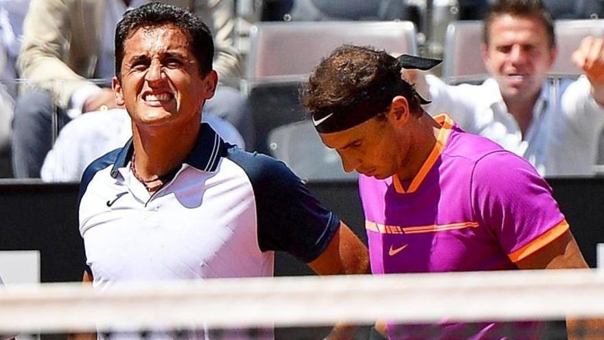 Nicolás Almagro y Rafa Nadal, tras la lesión del murciano.