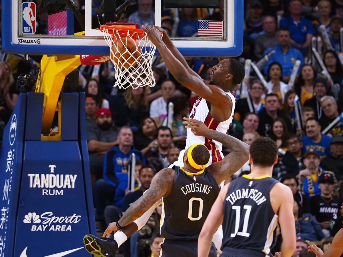 Feb 10, 2019; Oakland, CA, USA; Miami Heat center Bam Adebayo (13) dunks the ball above Golden State Warriors center DeMarcus Cousins (0) during the fourth quarter at Oracle Arena. Mandatory Credit: Kelley L Cox-USA TODAY Sports