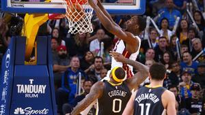 Feb 10, 2019; Oakland, CA, USA; Miami Heat center Bam Adebayo (13) dunks the ball above Golden State Warriors center DeMarcus Cousins (0) during the fourth quarter at Oracle Arena. Mandatory Credit: Kelley L Cox-USA TODAY Sports