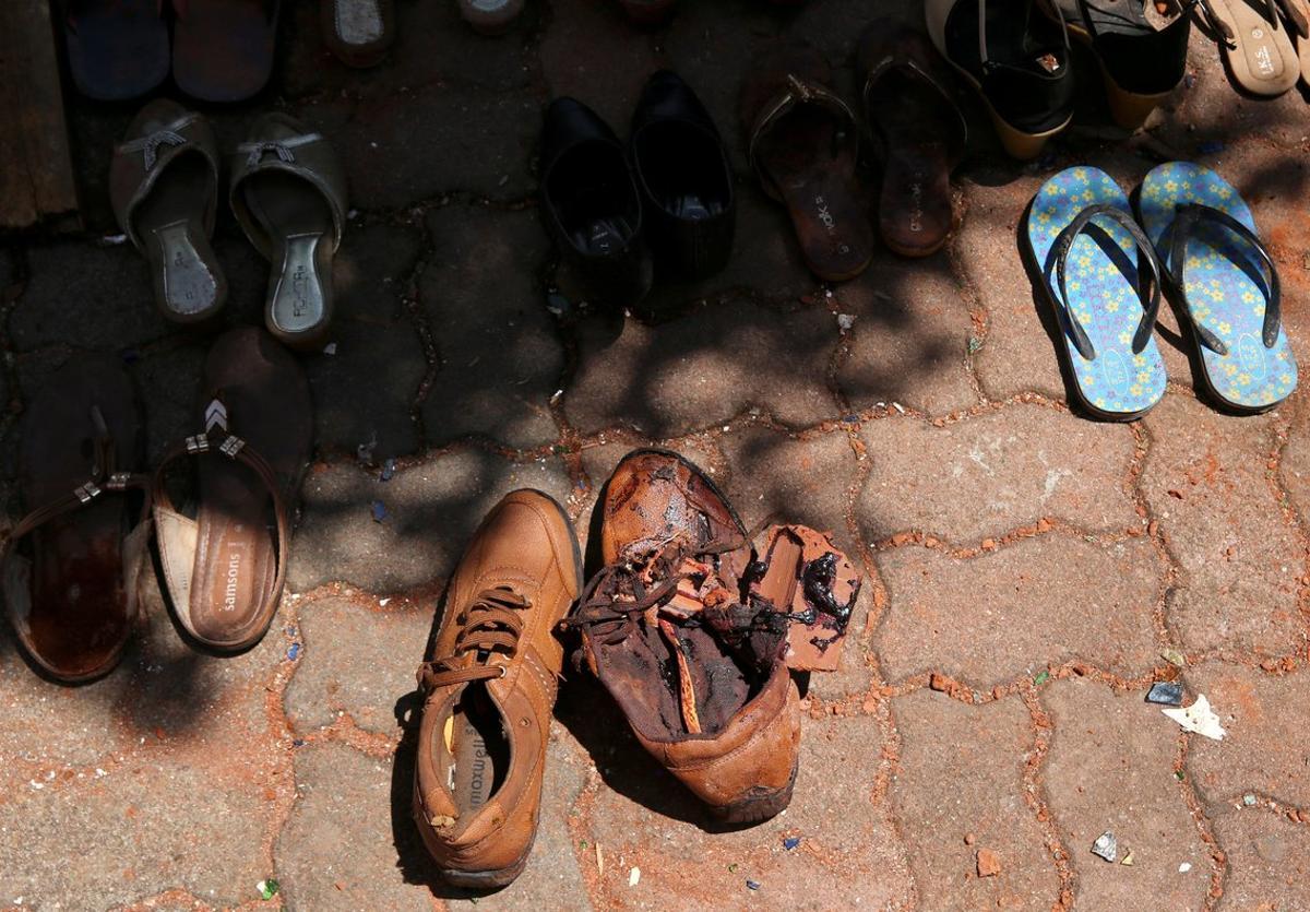 Blood is seen on a pair of shoes at St  Sebastian Catholic Church  after bomb blasts ripped through churches and luxury hotels on Easter  in Negambo  Sri Lanka April 22  2019  REUTERS Athit Perawongmetha TEMPLATE OUT