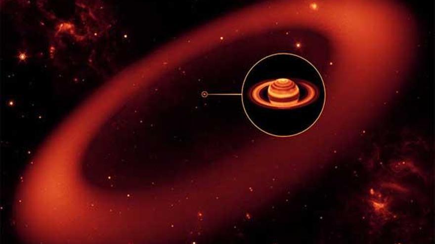 Recreación computerizada de un nuevo y gigante anillo alrededor de Saturno, localizado por el telescopio espacial Spitzer, de la Nasa