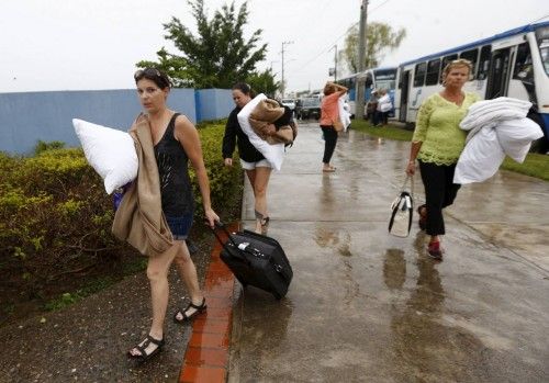Tourists, who were evacuated from their hotel arrive at the University of Puerto Vallarta used as a shelter as Hurricane Patricia approaches the Pacific beach resort of Puerto Vallarta