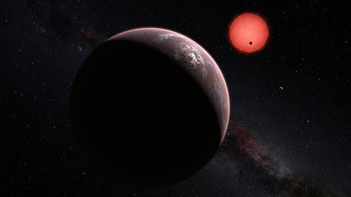 Recreación artística de un sector del sistema dominado por la estrella TRAPPIST-1 y sus planetas.