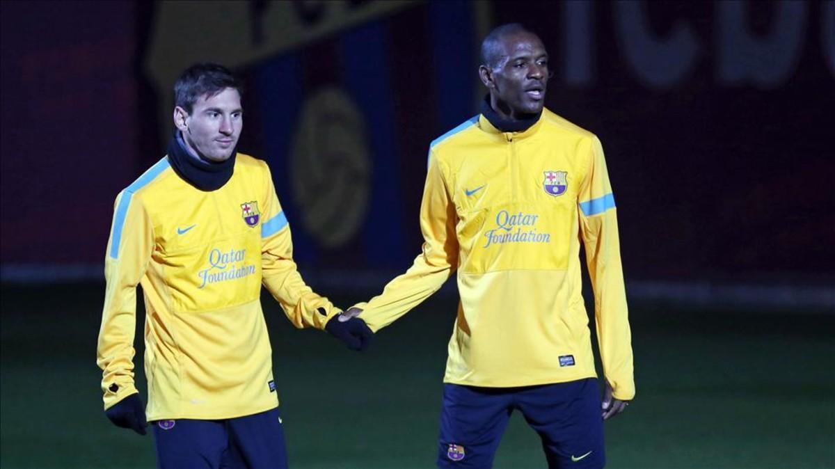 Messi y Abidal, en un entrenamiento del Barça