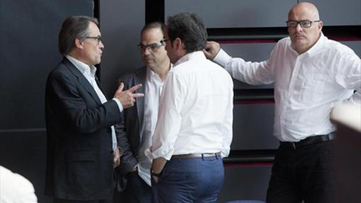 Artur Mas, Jordi Turull y Josep Rull, en el Born Centre Cultural tras las elecciones del 27-S.