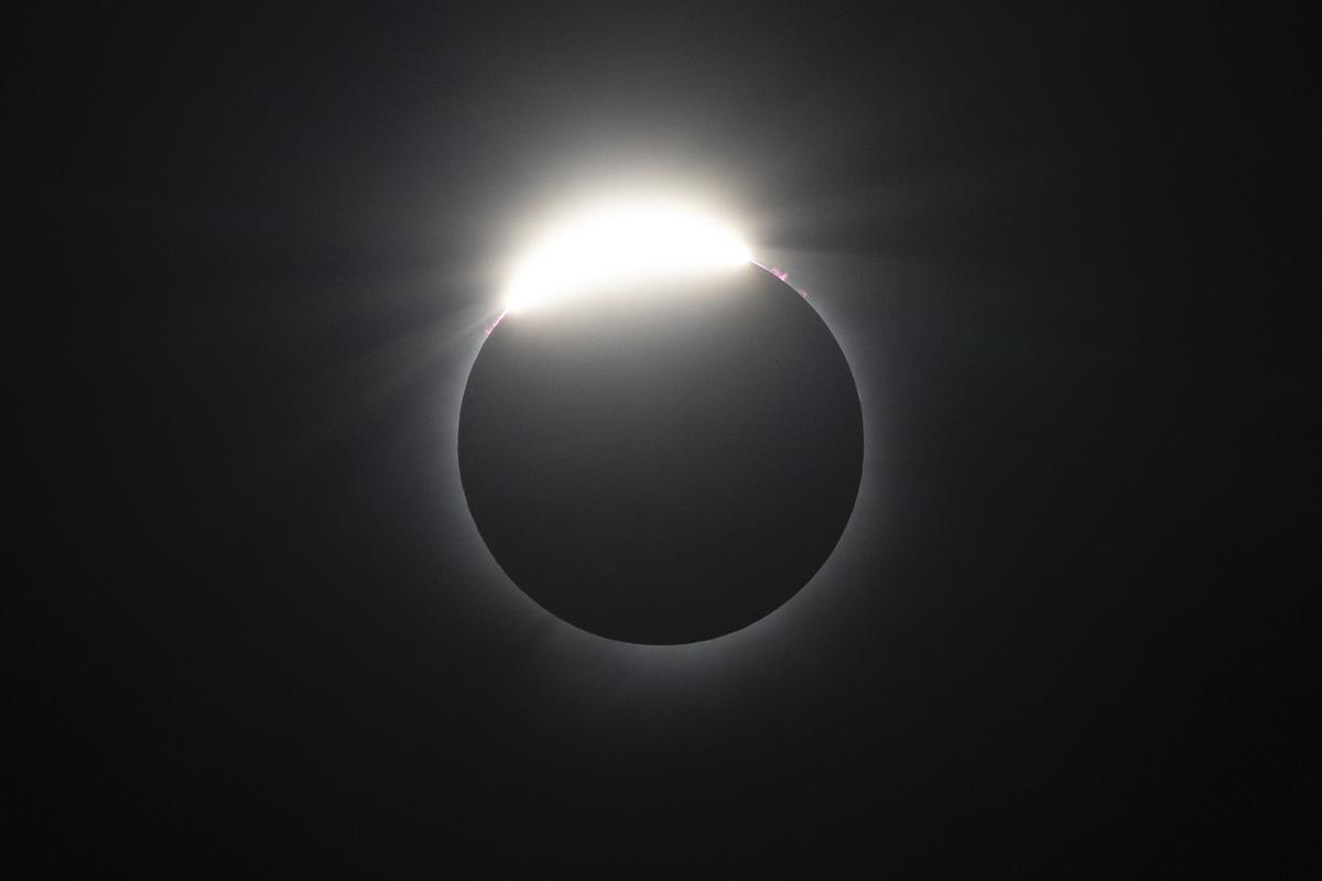 The moon nearly covers the sun during a total solar eclipse, as seen from Bishops University in Sherbrooke, Quebec, Monday, April 8, 2024. (AP Photo/Mark Schiefelbein)