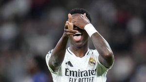 Real Madrids Vinicius Junior celebrates after scoring his sides 5th goal during the Champions League opening phase soccer match between Real Madrid and FC Salzburg at the Santiago Bernabeu stadium in Madrid, Wednesday, Jan. 22, 2025. (AP Photo/Manu Fernandez)