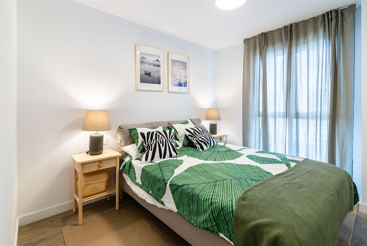 Uno de los dormitorios de Gran Capitán Homes