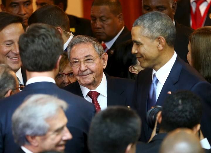 U.S. President Barack Obama and his Cuban counterpart Raul Castro talk with an unidentified man before the inauguration of the VII Summit of the Americas in Panama City