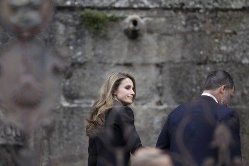 Spain's Crown Prince Felipe and Princess Letizia arrive to attend a funeral service in memory of the victims of the July 24, 2013 train crash, at the Cathedral of Santiago de Compostela
